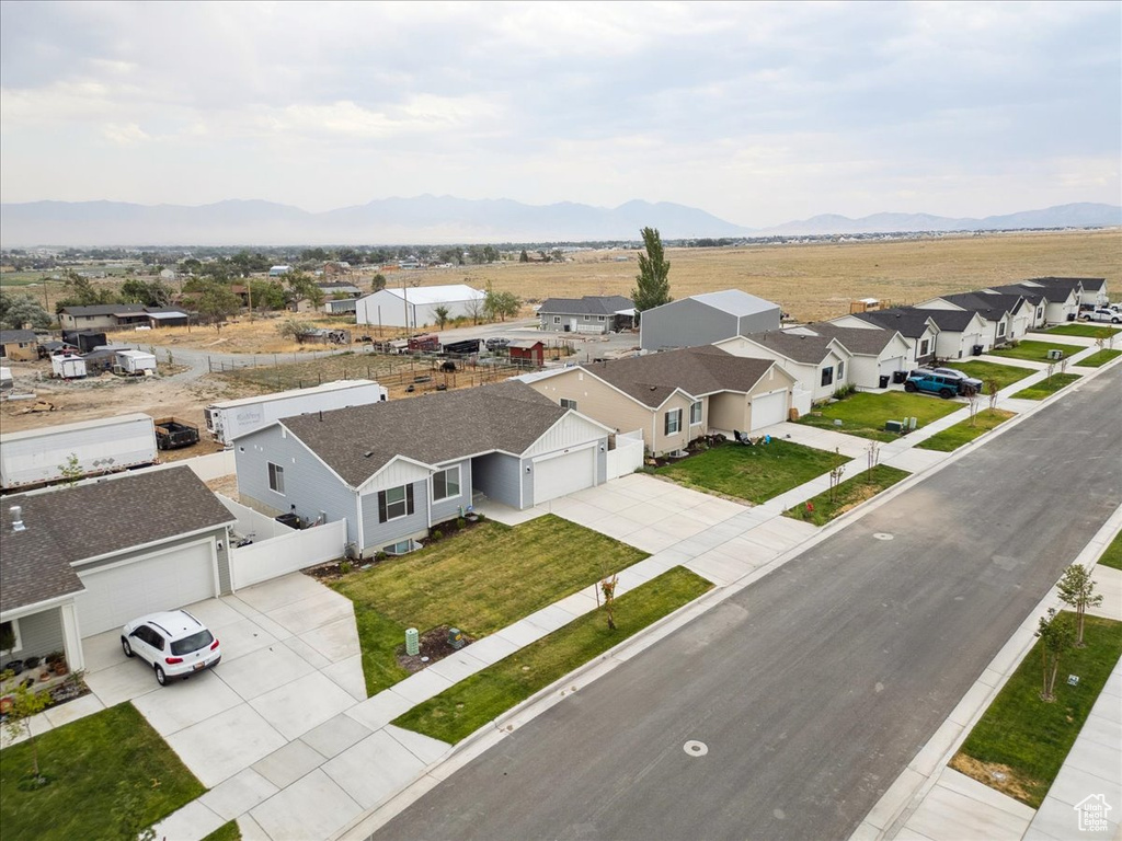 Aerial view of residential area with a mountainous background