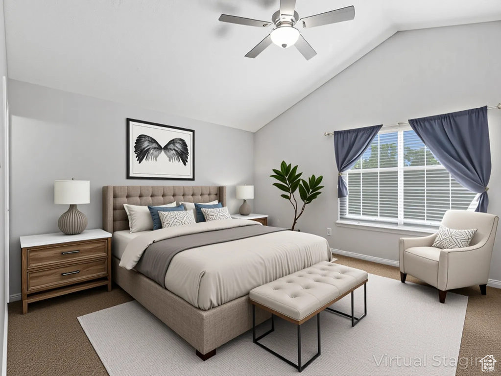 Bedroom featuring lofted ceiling, carpet floors, and ceiling fan