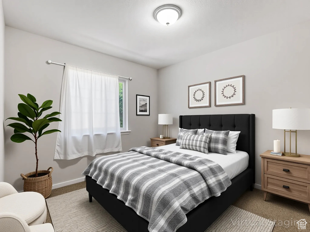 Bedroom featuring carpet floors and baseboards