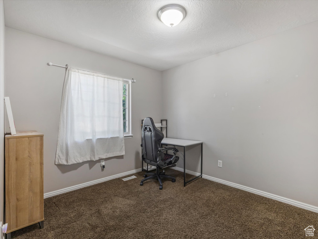 Office with carpet floors and baseboards