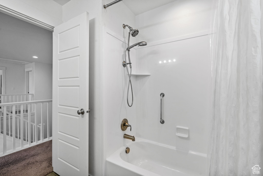 Full bathroom featuring shower / bathtub combination with curtain and recessed lighting