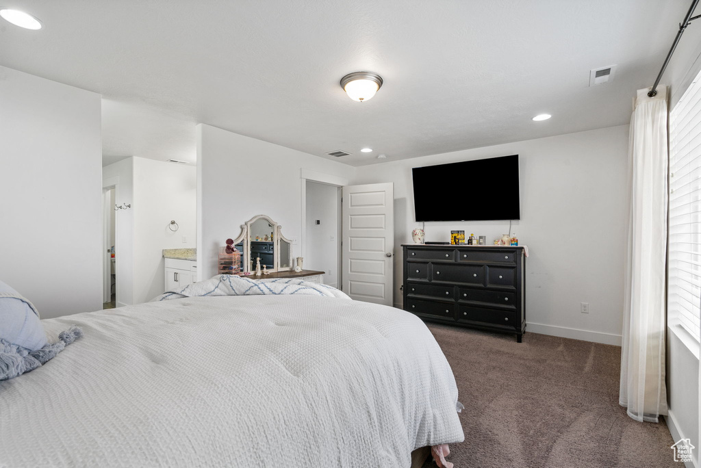 Carpeted bedroom featuring recessed lighting