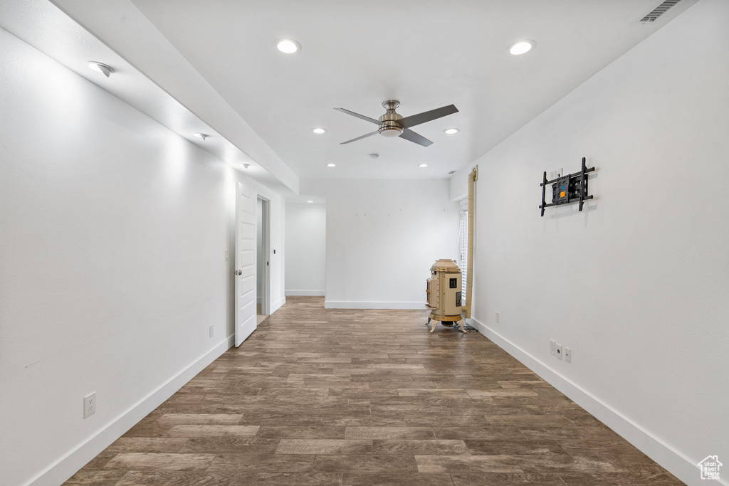 Empty room featuring ceiling fan, recessed lighting, and wood finished floors