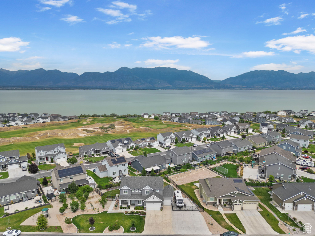 Aerial view of property\'s location featuring a water and mountain view and nearby suburban area