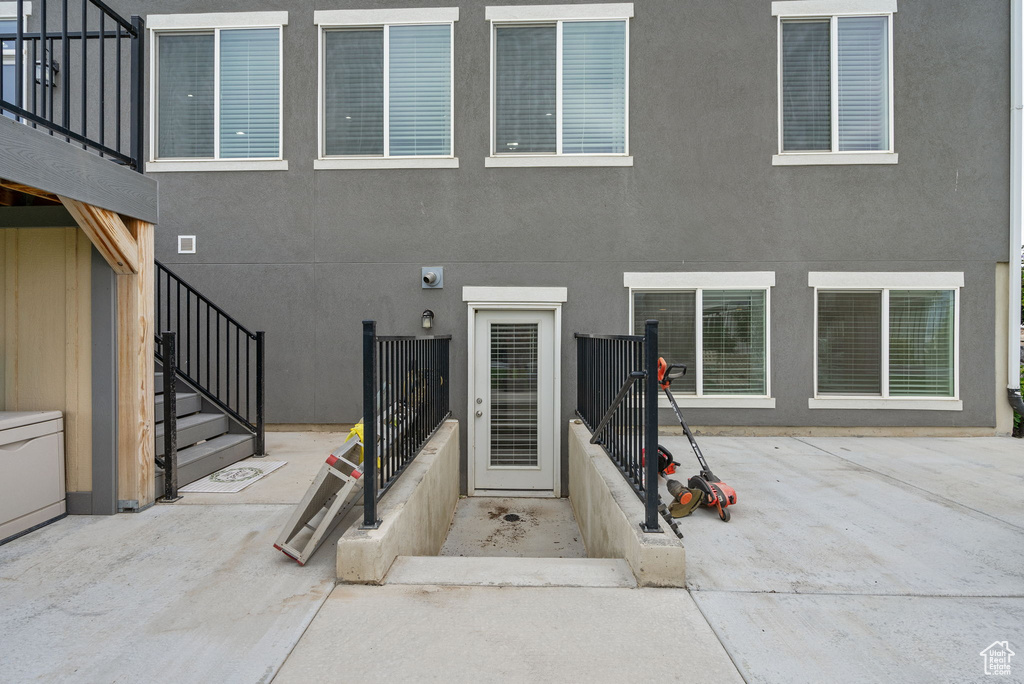 Property entrance with stucco siding