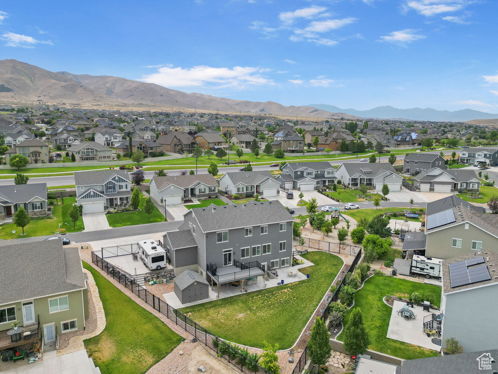 Aerial perspective of suburban area featuring a mountainous background