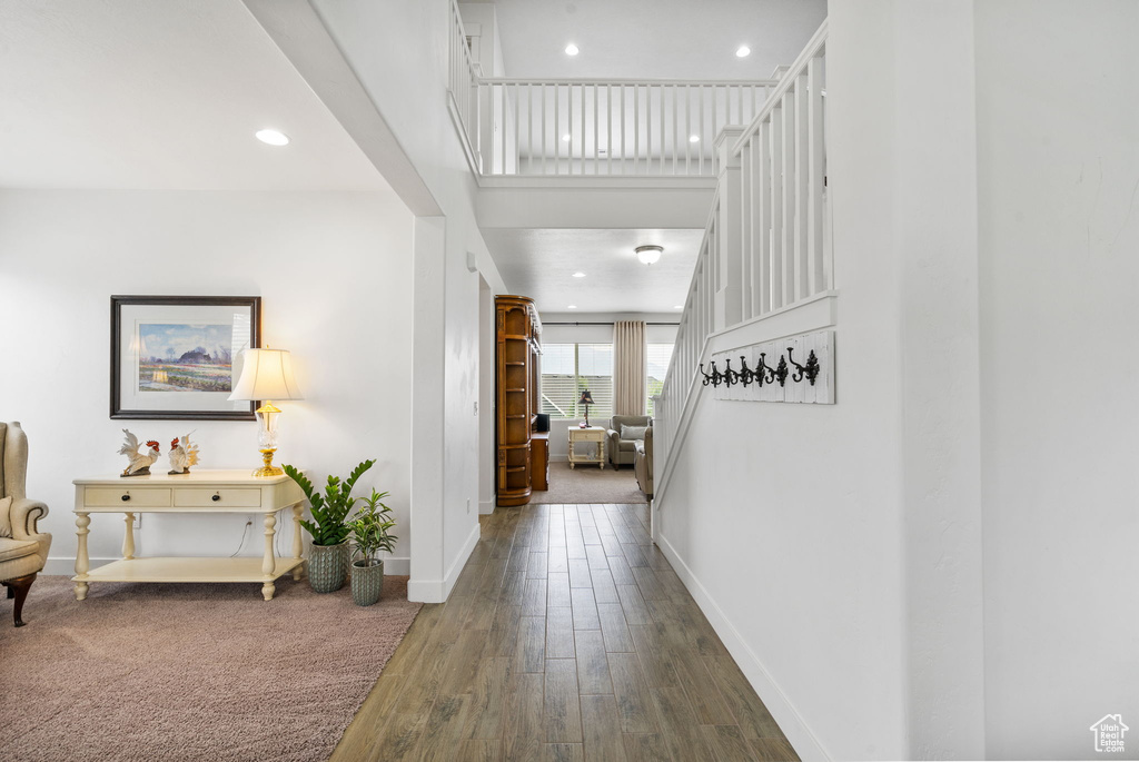 Corridor featuring wood finished floors and recessed lighting