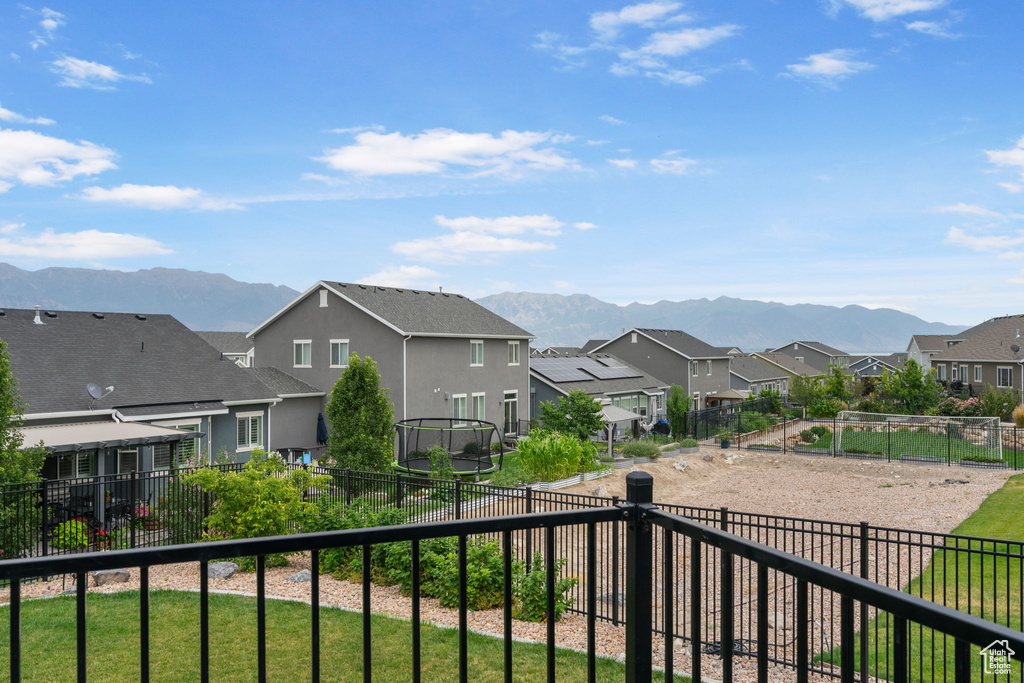 View of mountain backdrop featuring nearby suburban area
