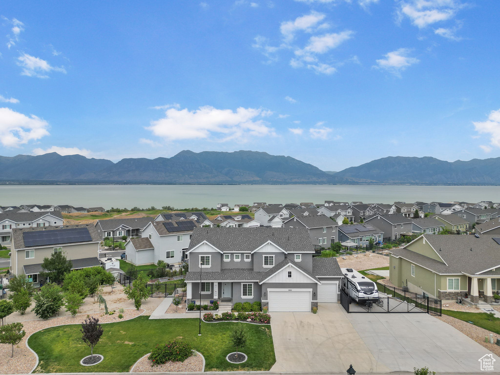 Mountain view with a large body of water and nearby suburban area