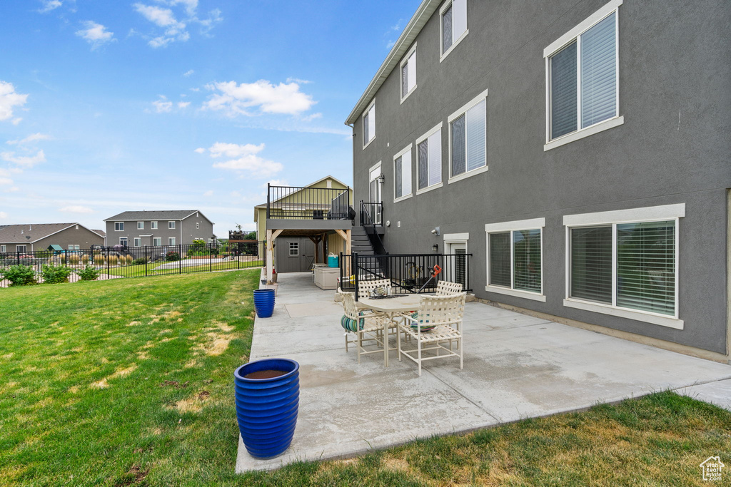 View of patio / terrace featuring stairs and a deck