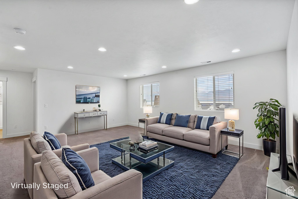 Living room featuring carpet and recessed lighting