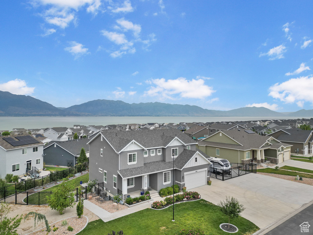 View of mountain background featuring nearby suburban area and a nearby body of water