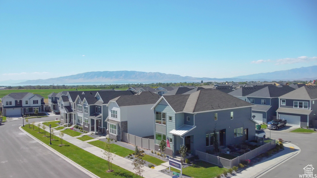 Aerial view of residential area featuring mountains