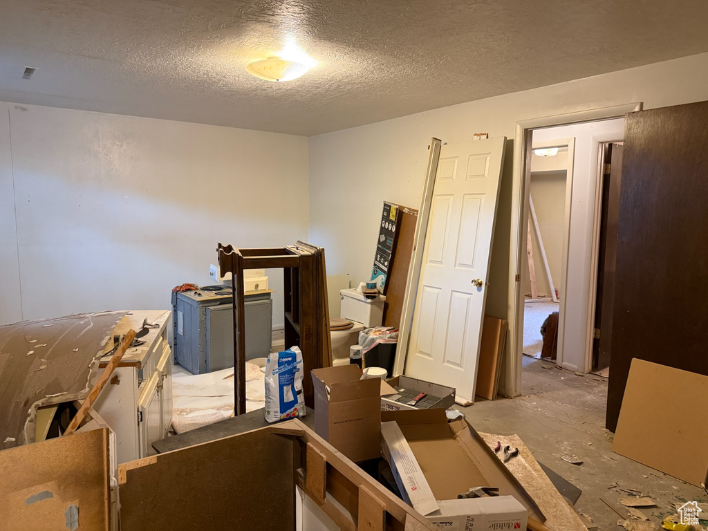 Misc room with a textured ceiling