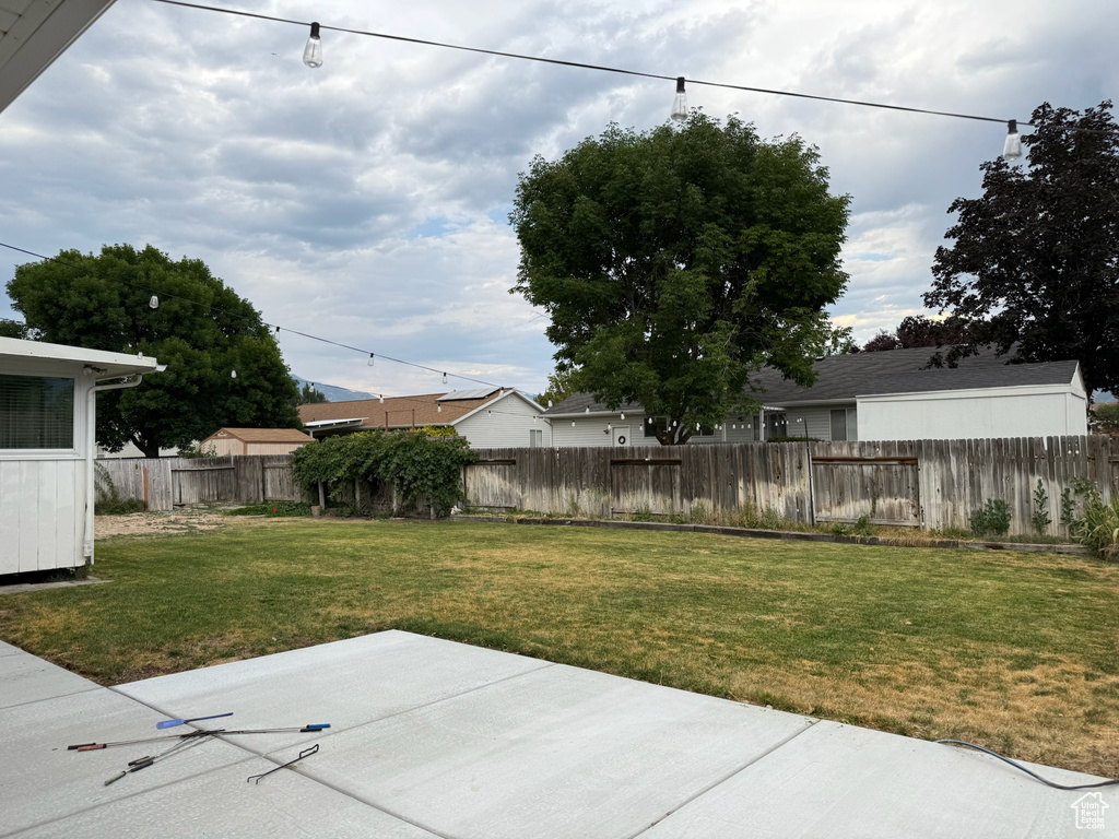 Fenced backyard featuring a patio