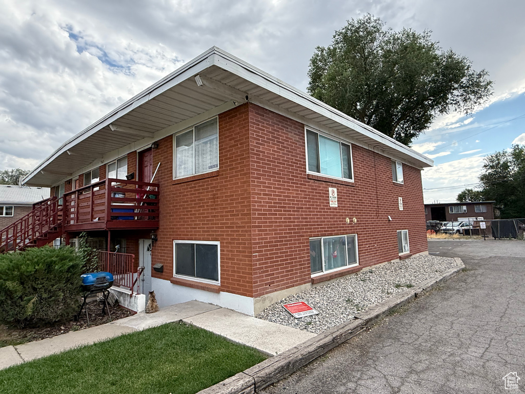 View of side of home featuring brick siding