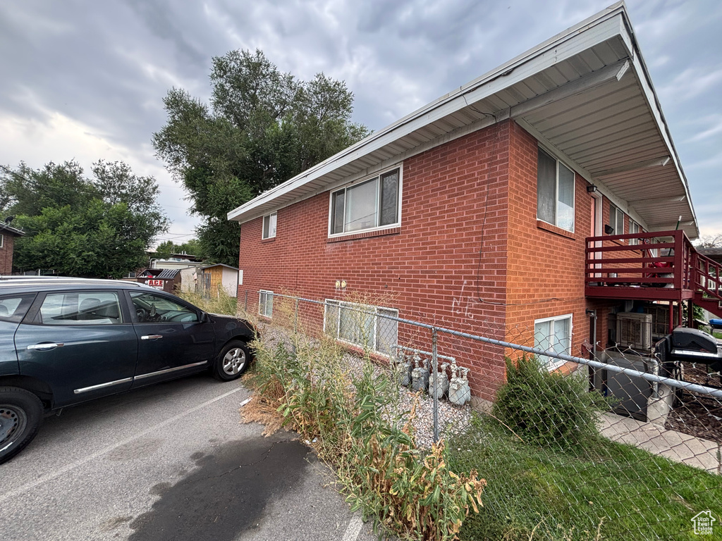 View of side of home with brick siding