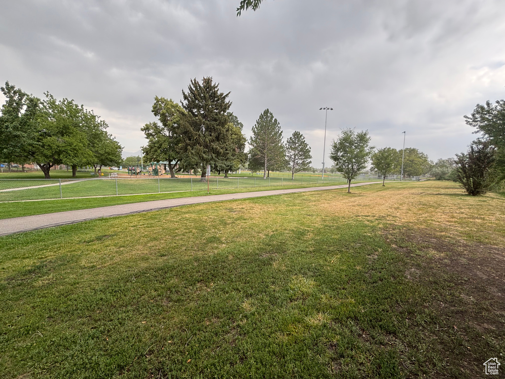 View of home's community with a yard