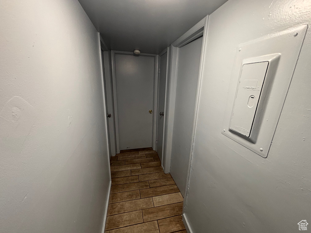 Hallway with wood tiled floors