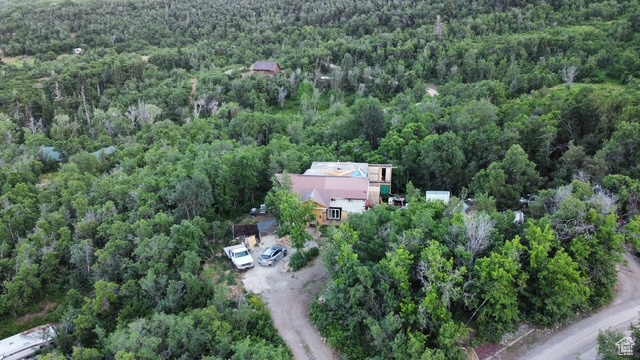 Aerial overview of property's location featuring a forest