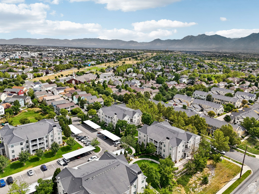 Aerial perspective of suburban area featuring a mountainous background