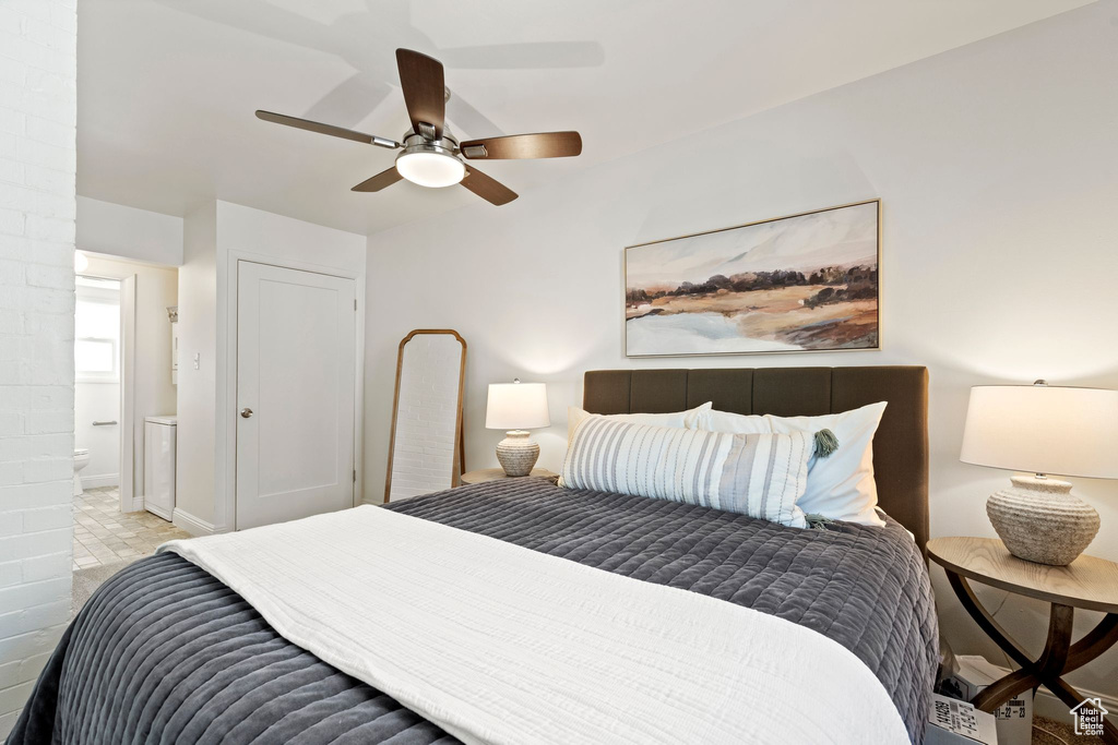 Bedroom with ensuite bathroom and a ceiling fan