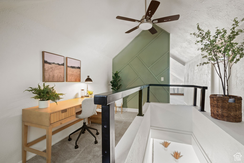 Office featuring carpet floors, ceiling fan, and lofted ceiling