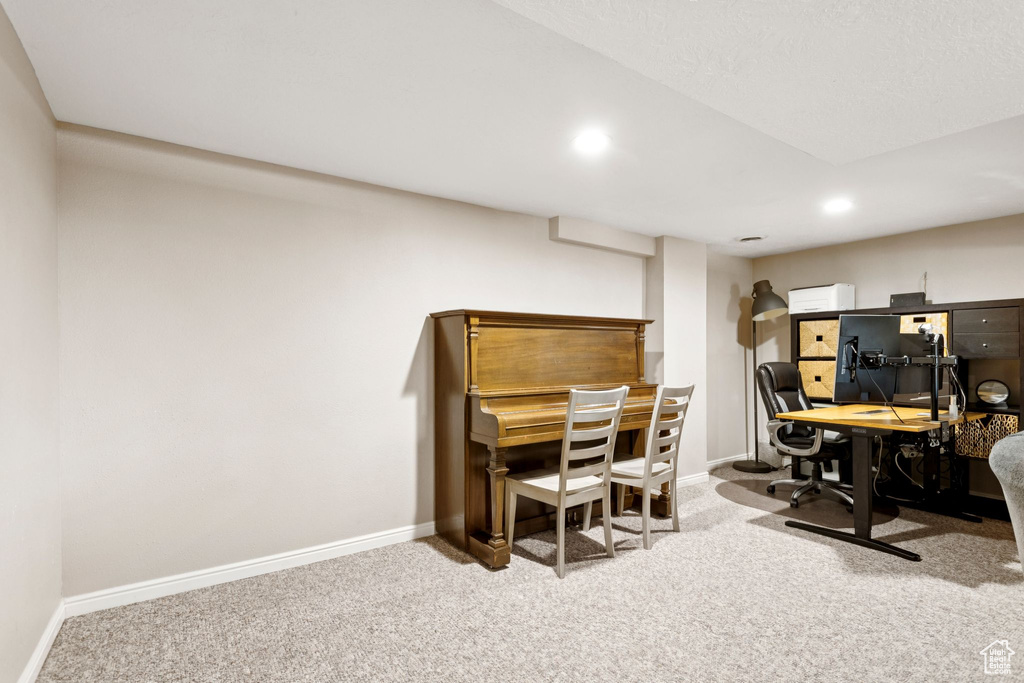 Home office with carpet flooring and recessed lighting
