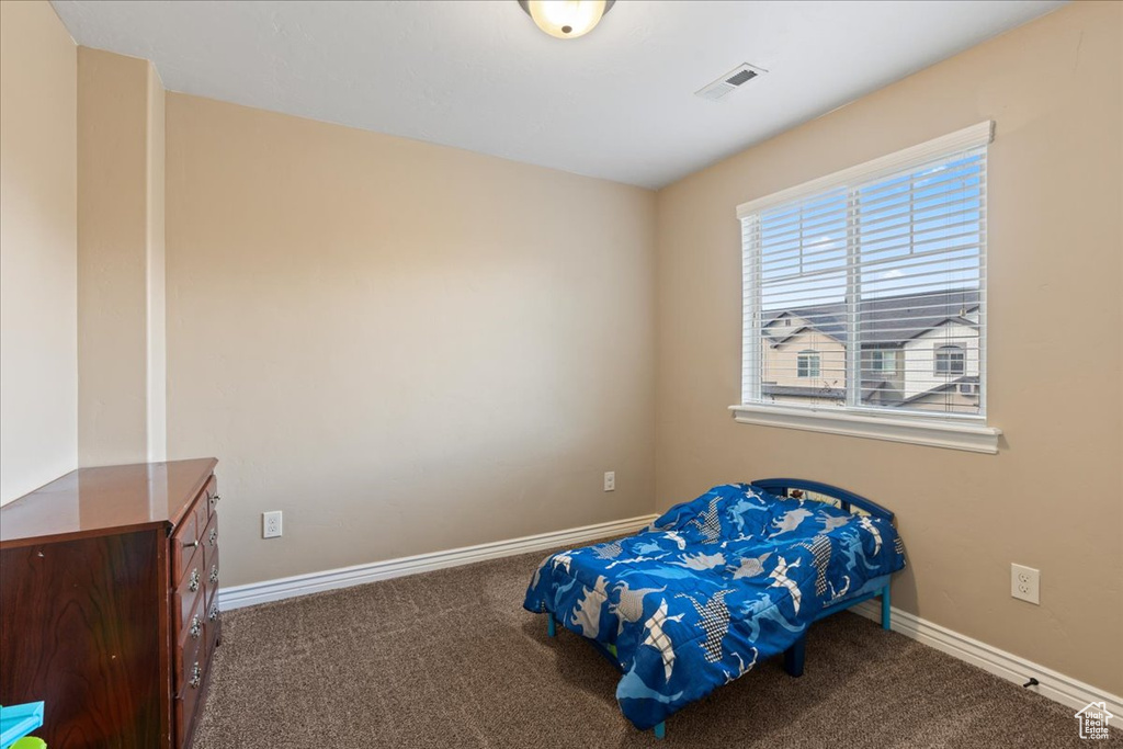 Bedroom featuring carpet flooring