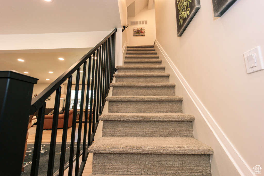 Stairway featuring recessed lighting