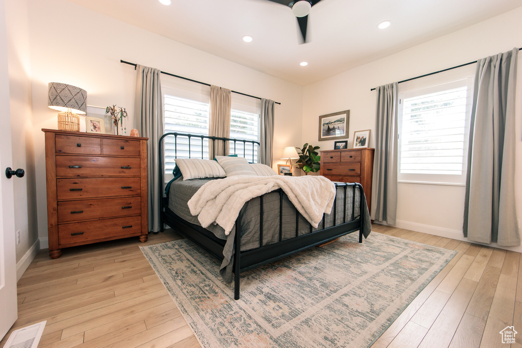 Bedroom featuring light wood-style flooring, recessed lighting, and a ceiling fan