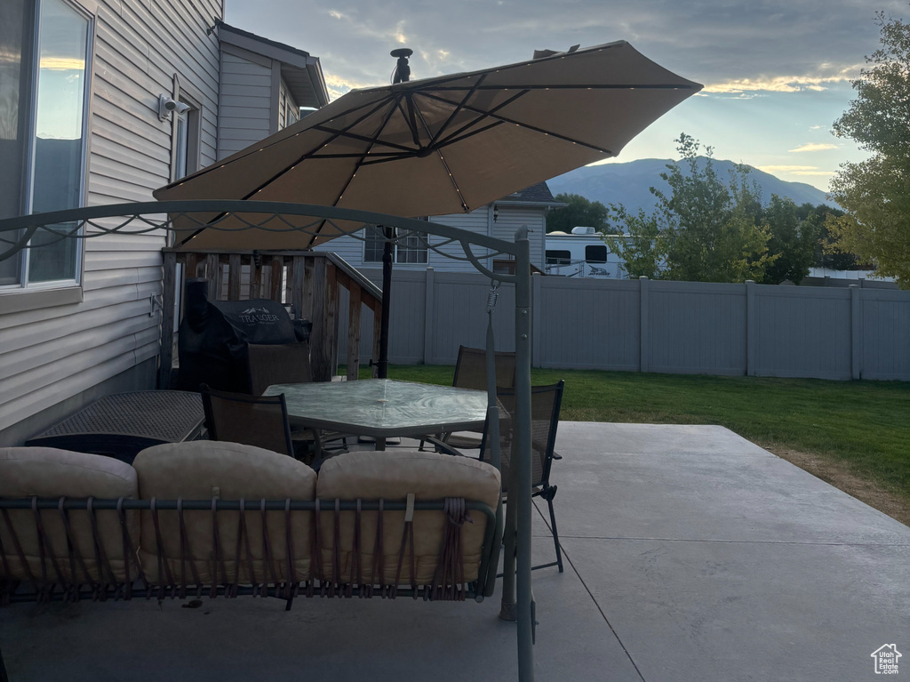 View of patio / terrace featuring a mountain view and outdoor dining area