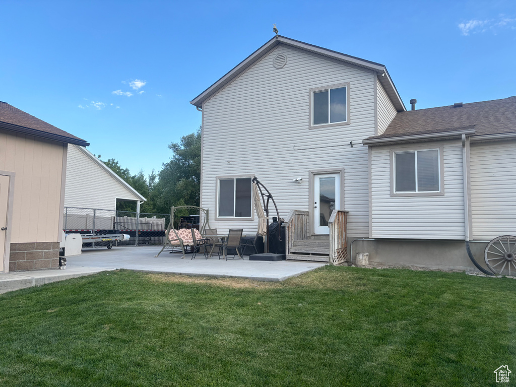 Rear view of house featuring a patio area