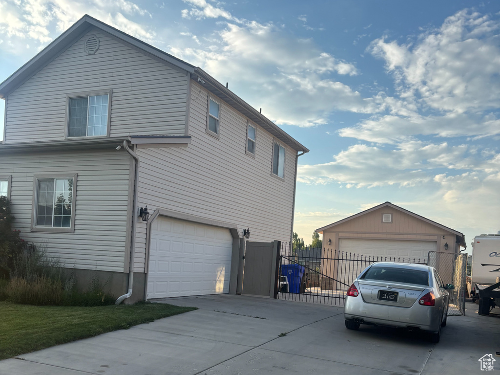 View of side of property featuring driveway