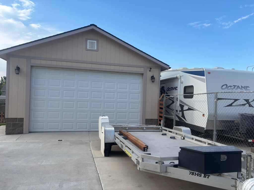 Garage featuring driveway