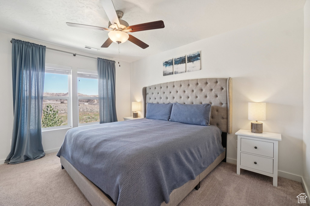 Bedroom with carpet floors and ceiling fan
