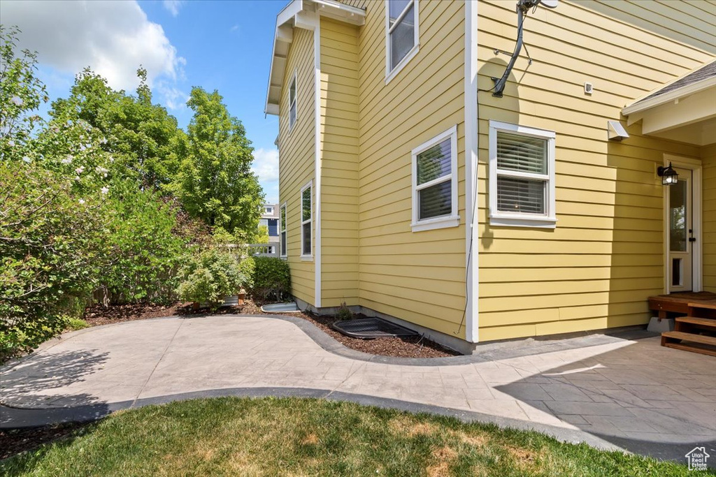 View of side of property featuring a patio