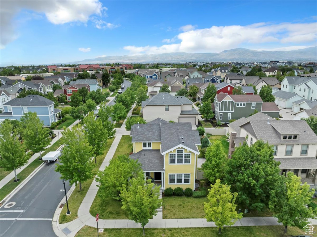 Aerial view of residential area featuring a mountainous background