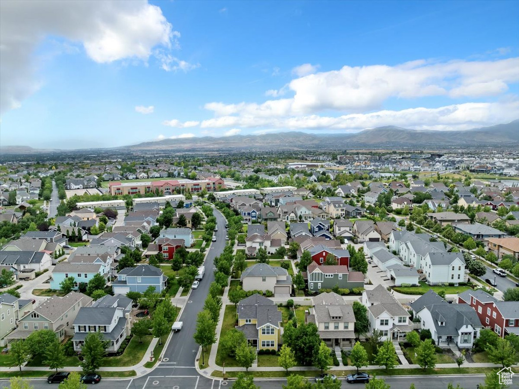 Aerial perspective of suburban area with a mountain backdrop