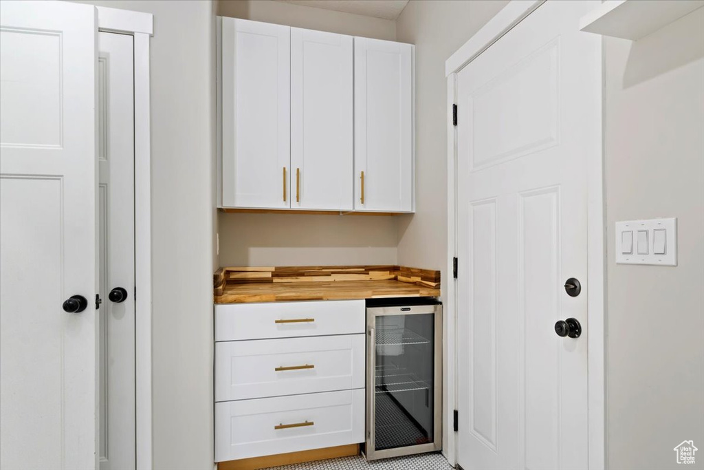Indoor dry bar featuring beverage cooler