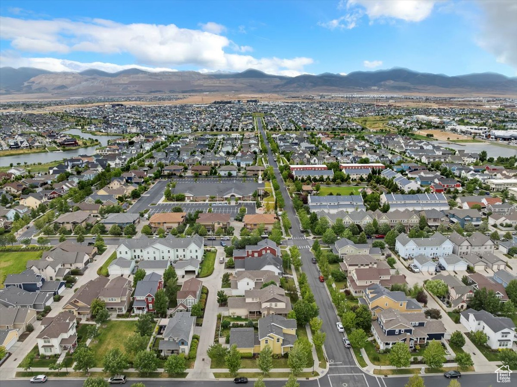 View of property location with nearby suburban area and a water and mountain view