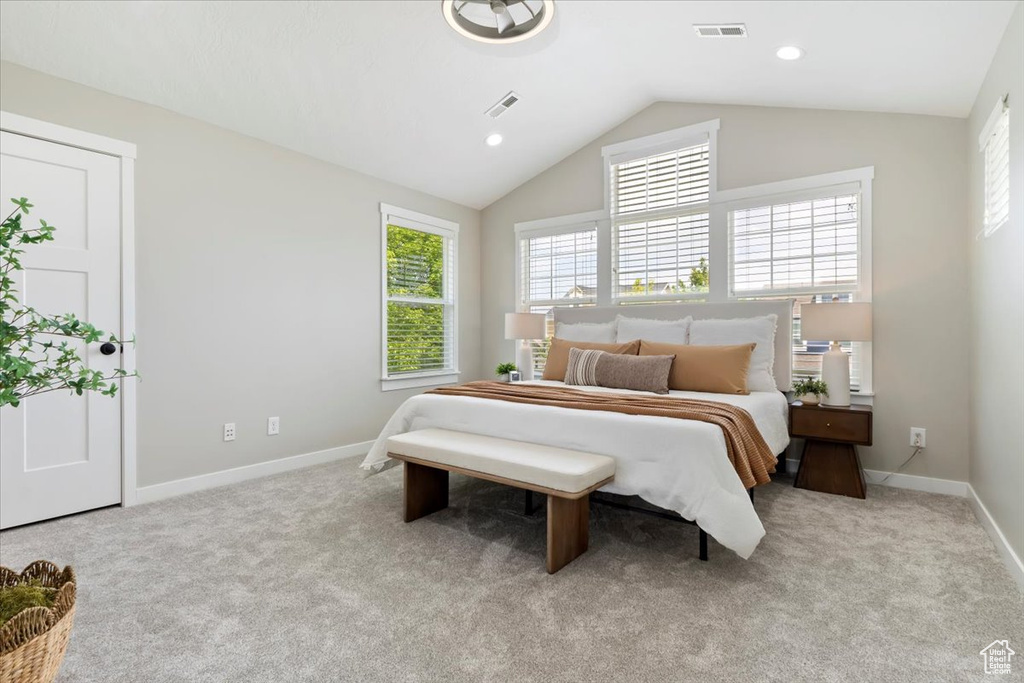 Bedroom featuring multiple windows, carpet flooring, vaulted ceiling, and recessed lighting