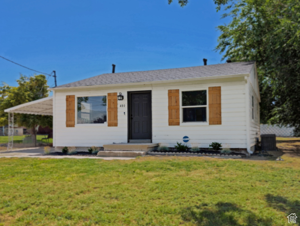 View of front of property with a front lawn
