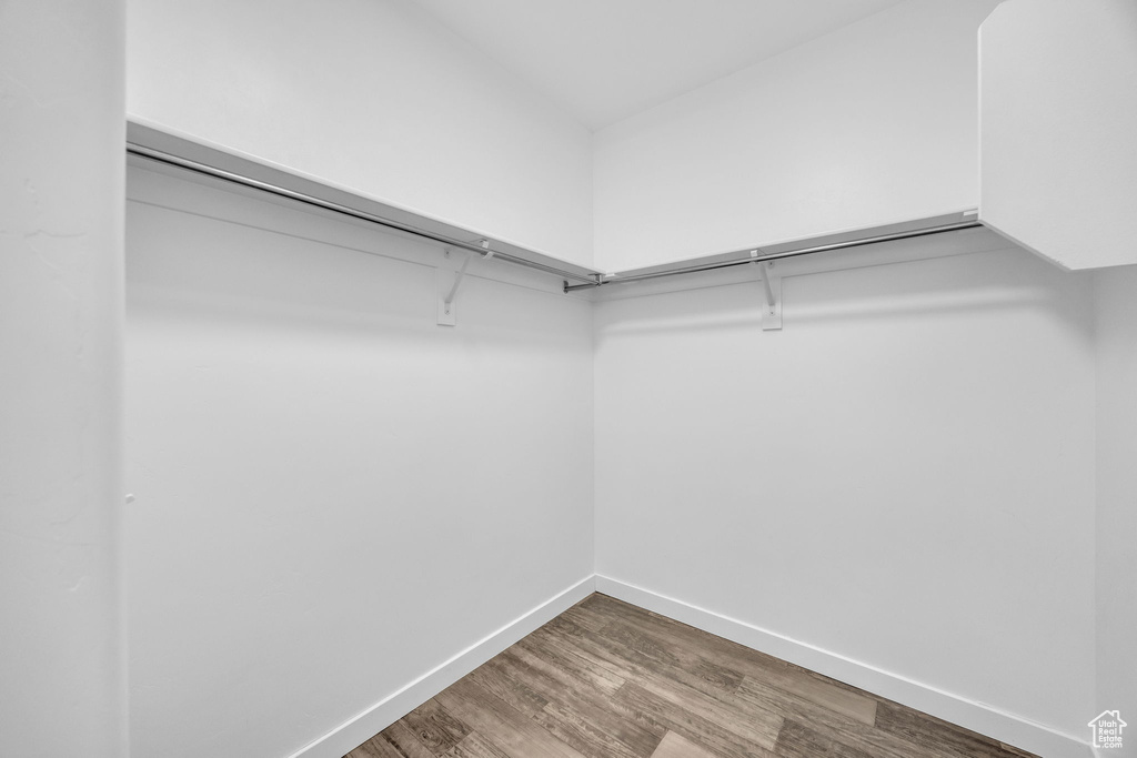 Spacious closet with wood finished floors
