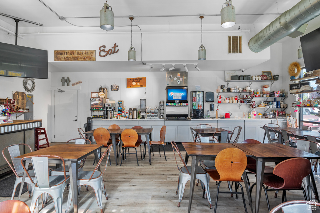 Dining area with light wood-type flooring