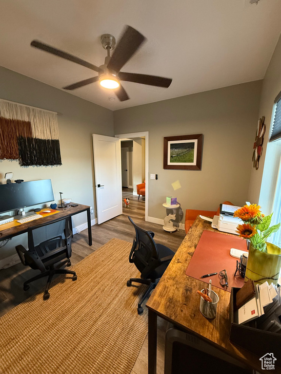 Office with a ceiling fan and wood finished floors