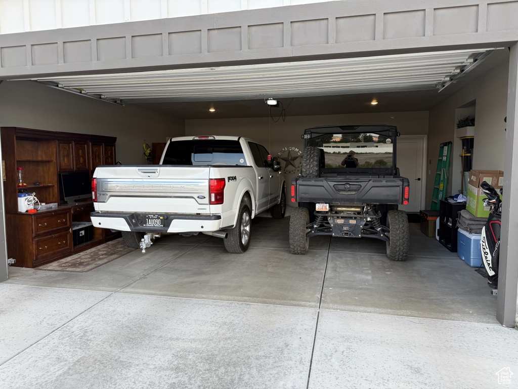 Garage featuring driveway