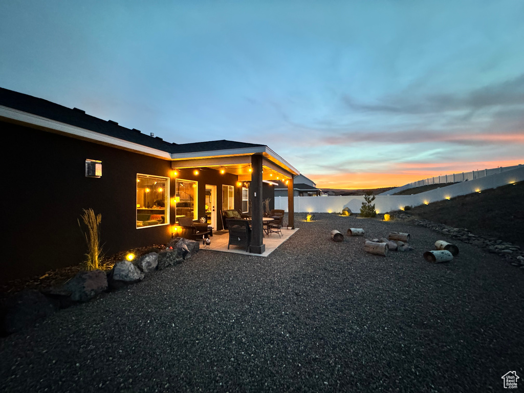 Fenced backyard with a patio area