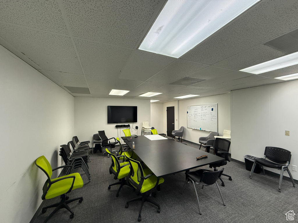 Home office featuring carpet flooring and a paneled ceiling