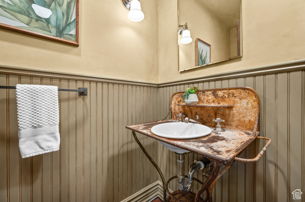 Bathroom with a wainscoted wall
